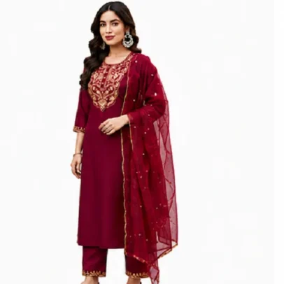 Beautiful woman wearing a maroon Roman silk embroidered kurta set with matching pants and sheer dupatta, ideal for festive occasions, weddings, office wear, and ethnic celebrations.