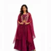 Beautiful woman wearing a maroon embroidered lehenga set with a stylish cape-style dupatta, perfect for weddings, festive occasions, and party wear.