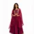 Beautiful woman wearing a maroon embroidered lehenga set with a stylish cape-style dupatta, perfect for weddings, festive occasions, and party wear.