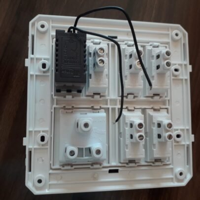 White modular electrical switch board with fan regulator and socket panel