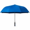 Blue oversized travel umbrella with wide waterproof canopy and wind-resistant frame for daily rain protection.