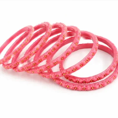 Pink floral beaded bangles set of 24 with golden bead detailing for women and girls.