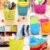Round multicolor plastic utility basket with side handles