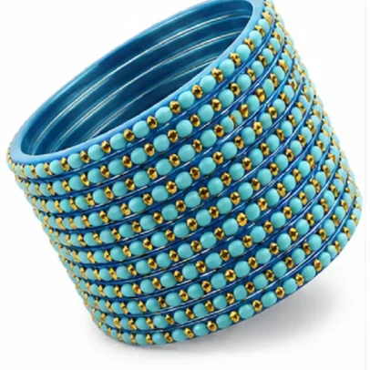 Set of 24 turquoise blue bangles with golden bead design for women and girls.