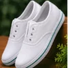 Kids white canvas school shoes with lightweight rubber sole, breathable fabric, lace-up design, comfortable everyday shoes for boys and girls aged 4–7 years.