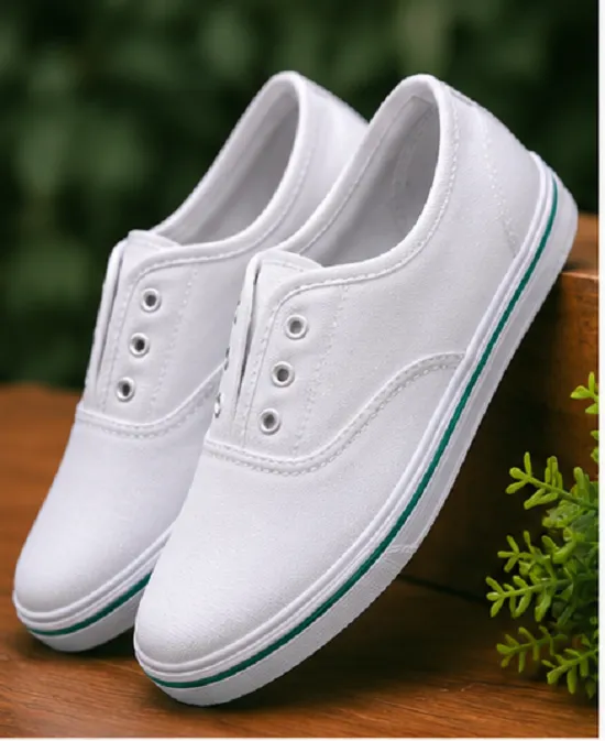 Kids white canvas school shoes with lightweight rubber sole, breathable fabric, lace-up design, comfortable everyday shoes for boys and girls aged 4–7 years.