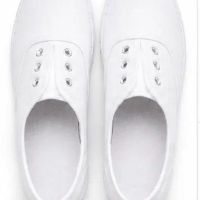 Kids white canvas school shoes with breathable fabric upper, lightweight rubber sole, lace-up eyelets, comfortable everyday uniform shoes for boys and girls.