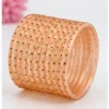 Peach 24 PCS glass bangles set with golden dot design for women and girls, traditional Indian kanch ki chudi set for weddings and festivals.