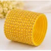 Yellow 24 PCS stone studded plastic bangles set for women and girls, traditional Indian chudi set for festivals, weddings, bridal wear and ethnic outfits.