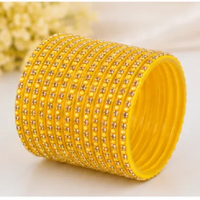Yellow 24 PCS stone studded plastic bangles set for women and girls, traditional Indian chudi set for festivals, weddings, bridal wear and ethnic outfits.