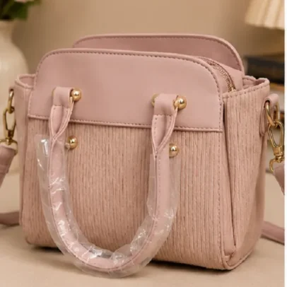Women's Blush Pink Textured Top Handle Handbag with Dual Handles and Adjustable Shoulder Strap