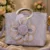 Fashion Women's Lavender Floral Glitter Tote Bag with 3D Flower Applique, Metallic Top Handle, and Shoulder Strap