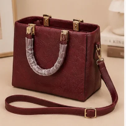 Women's Maroon Embossed Top Handle Handbag with Gold Hardware