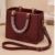 Women's Maroon Embossed Top Handle Handbag with Gold Hardware